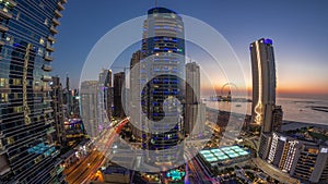 Panorama of the Dubai Marina and JBR area and the famous Ferris Wheel aerial day to night