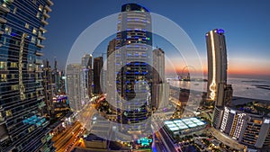 Panorama of the Dubai Marina and JBR area and the famous Ferris Wheel aerial day to night timelapse