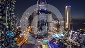 Panorama of the Dubai Marina and JBR area and the famous Ferris Wheel aerial day to night timelapse