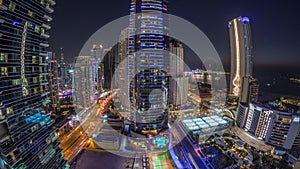 Panorama of the Dubai Marina and JBR area and the famous Ferris Wheel aerial day to night timelapse