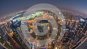 Panorama of Dubai Marina with JLT skyscrapers and golf course day to night timelapse, Dubai, United Arab Emirates.