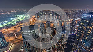 Panorama of Dubai Marina with JLT skyscrapers and golf course day to night timelapse, Dubai, United Arab Emirates.