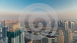 Panorama of Dubai Marina with JLT skyscrapers and golf course timelapse, Dubai, United Arab Emirates.