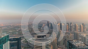 Panorama of Dubai Marina with JLT skyscrapers and golf course timelapse, Dubai, United Arab Emirates.