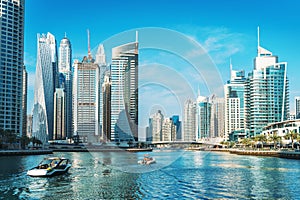 Panorama of Dubai Marina in UAE, modern skyscrapers and port with luxury yachts