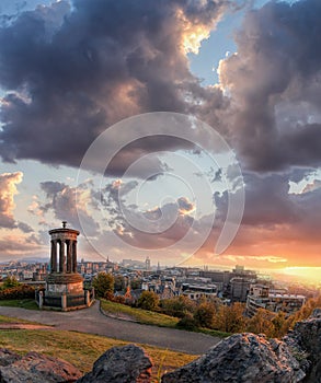 Panorama of Edinburgh against sunset with Calton Hill and castle in Scotland