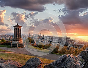 Panorama of Edinburgh against sunset with Calton Hill and castle in Scotland