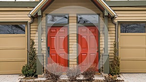 Panorama Entrance of townhouses with vibrant glass paned front doors and garage doors