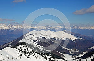panorama of the European Alps mountain range in winter with snow-capped peaks without people with blue sky