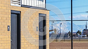 Panorama Exterior of the public restrooms at a park viewed on a sunny day