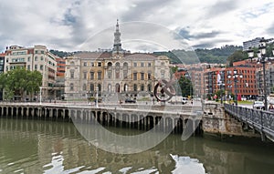 Panorama exterior view at the iconic Bilbao City Hall, Bilbao downtown city, Nervion river and river banks and buildings