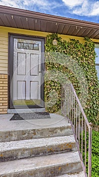 Panorama Facade of a home with view of the garage door and front door against blue sky