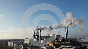 Panorama of the factory with smoke coming from the pipes