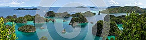 Panorama Fam Islands, Piaynemo, Raja Ampat, West Papua, Indonesia. Blue lagoon, green Islets, tropical paradise photo