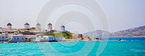 Panorama of famous view of traditional greek windmills on Mykonos island at sunrise, Cyclades, Greece