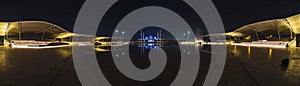 Panorama Fisheye view of Grand Mosque in Abu Dhabi, United Arab Emirates at night with a reflection in the pool