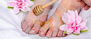 Panorama of a foot honey massage