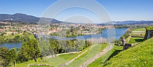 Panorama of fortified walls and river in Valenca do Minho photo
