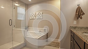 Panorama frame Bathroom interior with a shower stall beside the built in bathtub