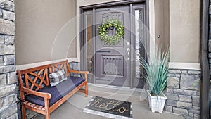 Panorama frame Beautiful home entrance with gray door sidelights and huge transom window photo