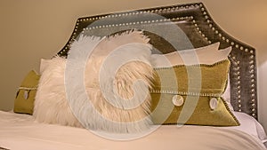 Panorama frame Bedroom interior with pillows against upholstered belgrave headboard of a bed