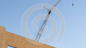 Panorama frame Building under construction with metal crane and blue sky background