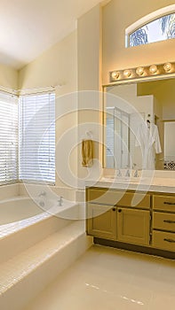 Panorama frame Built in bathtub and shower with glass door inside a beautiful bathroom