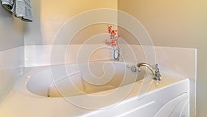 Panorama frame Built in bathtub with stainless steel faucet and glossy surface inside bathroom