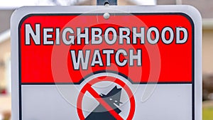 Panorama frame Close up of a Neighborhood Watch sign against a blurred background