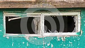 Panorama frame Close up of the small window with broken glass of an old and weathered shed