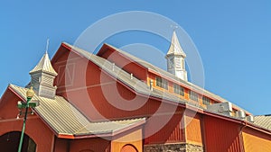 Panorama frame Colorful orange barn at a vinyard with clear blue sky background on a sunny day