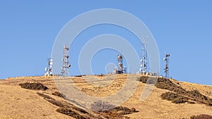 Panorama frame Communication towers on a mountain top day light