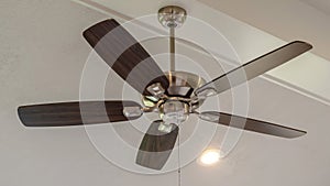 Panorama frame Electrical fan with built in lights installed on decorative wooden ceiling beam
