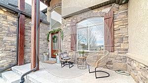 Panorama frame Exterior patio with two wicker comfy chairs