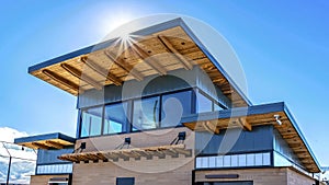 Panorama frame Facade of building with flat roof and brick wall against blue sky on a sunny day