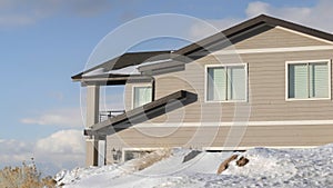 Panorama frame Home against cloudy blue sky at the snowy neighborhood of Wasatch Mountain