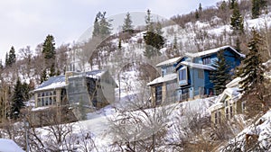Panorama frame Homes on residential mountain neighborhood in snowy Park City Utah in winter