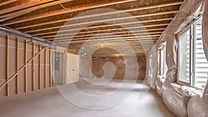 Panorama frame New home interior under construction with the wood framing visible