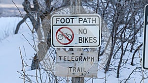 Panorama frame Signages by a foot path trail at Wasatch Mountains blanketed with snow in winter