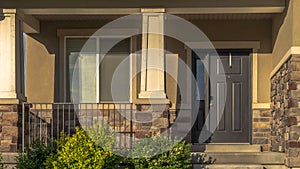 Panorama frame Stairs leading to porch and front door with sidelight at the entrance of home