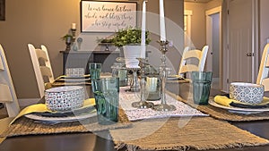 Panorama frame Table setting decorated with candles plants hemp table runners and placemats