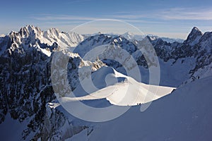 Panorama of French Alps with mountain ranges covered in snow in winter
