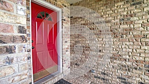 Panorama Front red door of a house with glass panel and bricks