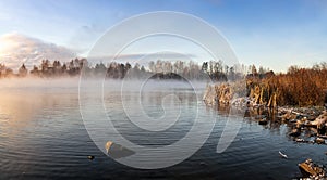 Panorama of frosty morning on the lake with fog, Russia, Ural, November