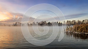 Panorama of frosty morning on the lake with fog, Russia, Ural, November