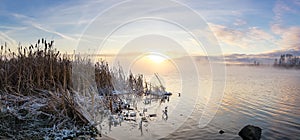 Panorama of frosty morning on the lake with fog, Russia, Ural, November