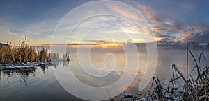 Panorama of frosty morning on the lake with fog, Russia, Ural, November