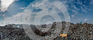 Panorama of the garbage dump full of litter, plastic bottles and other trash at the Thilafushi island