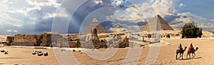 Panorama of the Giza Pyramid complex in Egypt, cloudy day view