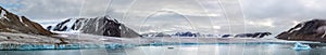 Panorama of a glacier and mountains in Ellesmere Island, part of the Qikiqtaaluk Canada.